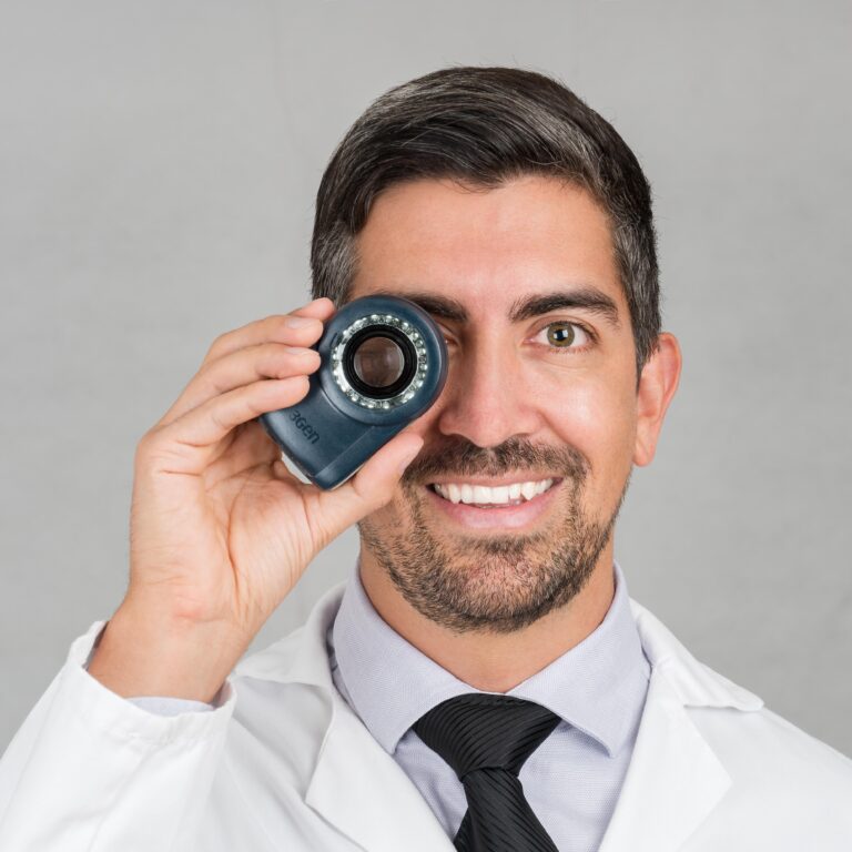 Dr. Sebastian Podlipnik holding a dermatoscope
