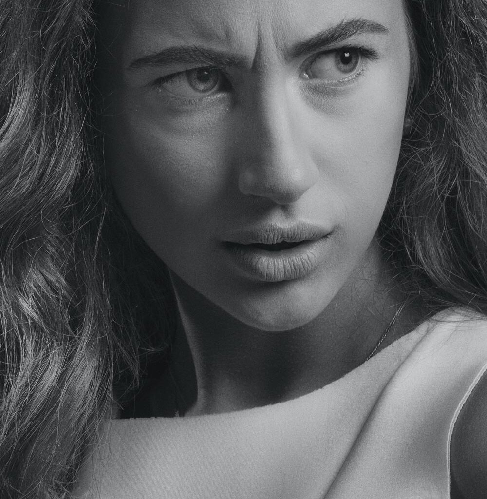 Portrait of a woman with wrinkles between her eyebrows